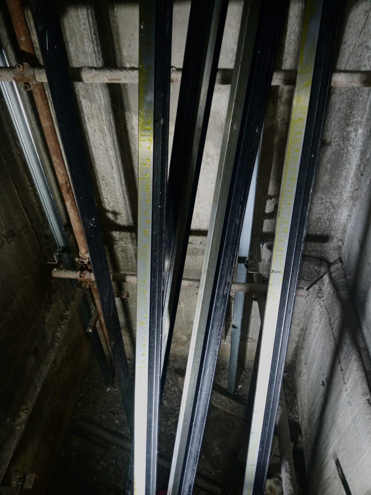 Guide rails inside elevator shaft under construction